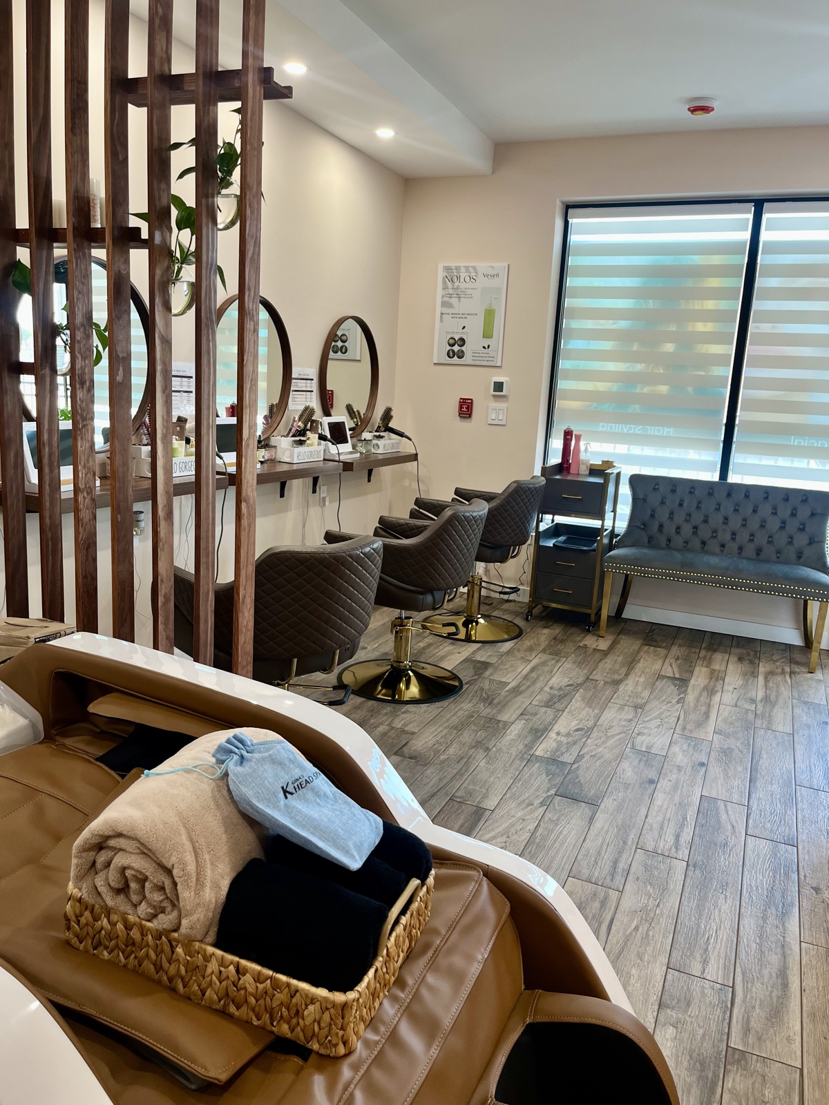 Inside Gina's K Head Spa — wash chairs, mirrors, warm wood